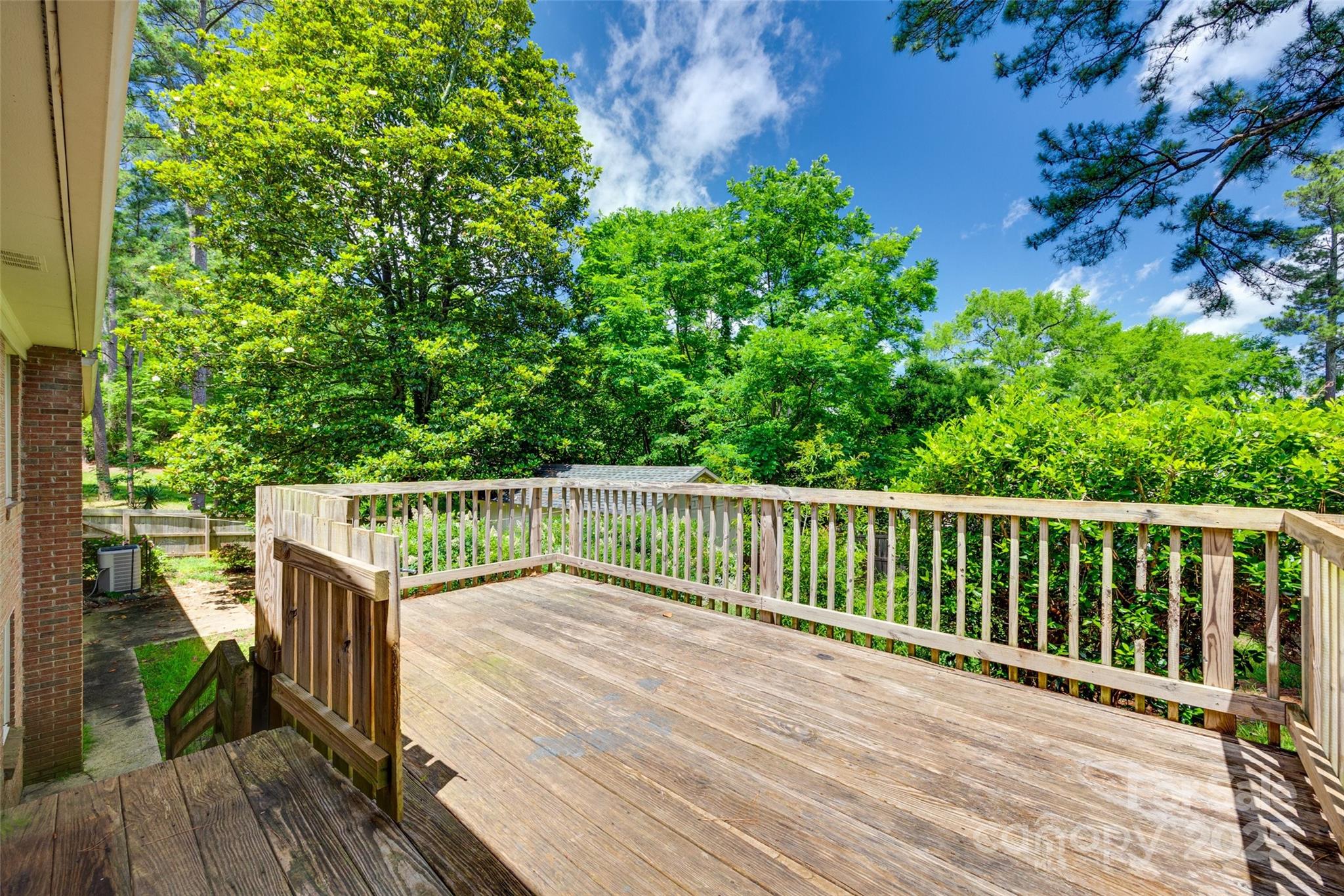 2001 Lakeview Drive Pineville, NC 28134 - Photo 28 of 35 a view of balcony with wooden floor and fence