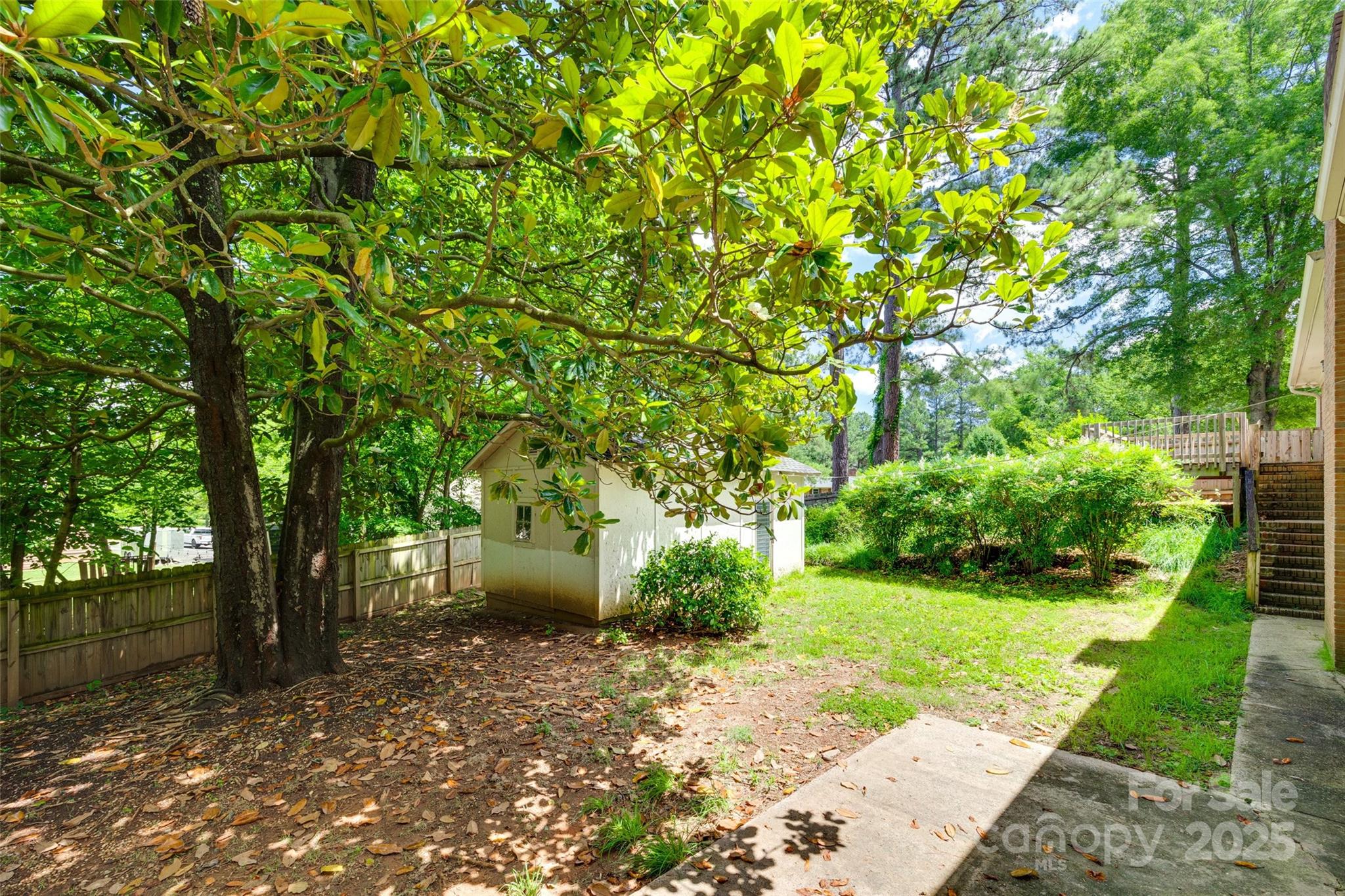 2001 Lakeview Drive Pineville, NC 28134 - Photo 30 of 35 a view of a backyard with plants and large trees