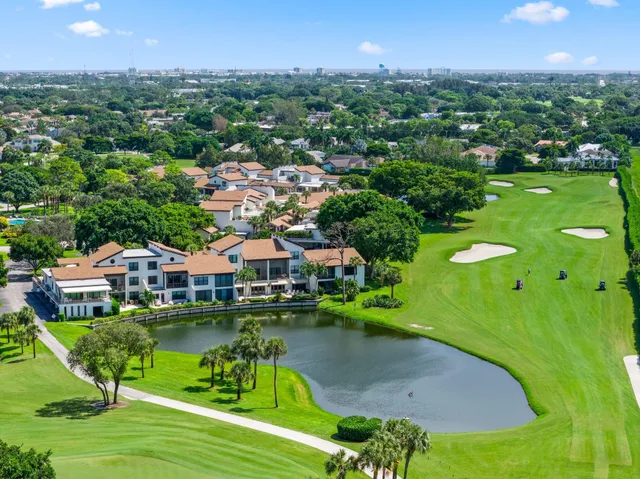 an aerial view of a houses with a lake view