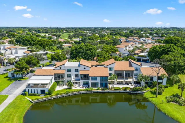 a front view of house with yard swimming pool and outdoor seating