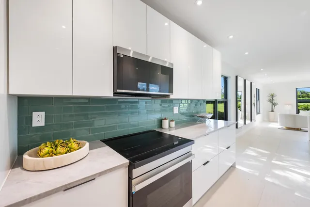 a kitchen with a stove and a microwave