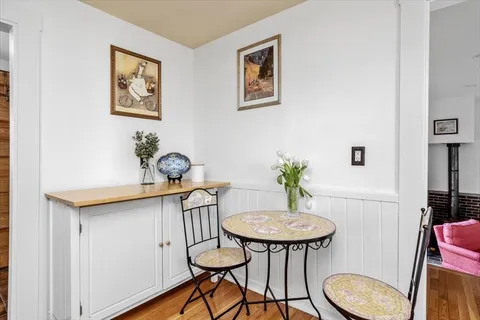 a view of a room with furniture and a potted plant