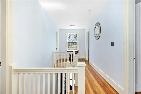 a view of a hallway with windows