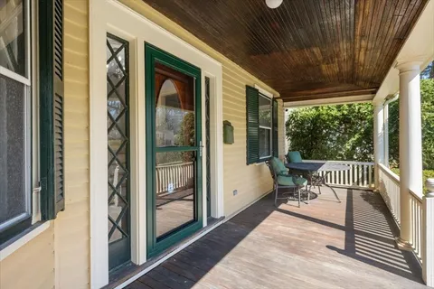 a view of porch with a bench