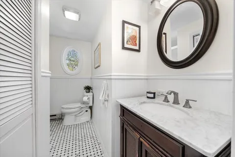 a bathroom with a sink a mirror and a toilet