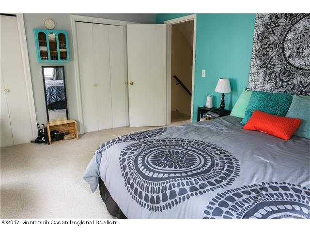 210 Osprey Court Tuckerton, NJ 08087 - Photo 11 of 24 a room with a bed and a table in it