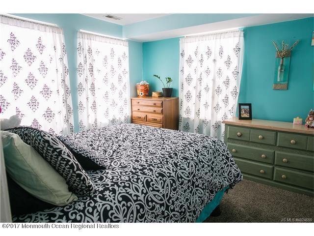 210 Osprey Court Tuckerton, NJ 08087 - Photo 12 of 24 a bedroom with a bed and a dresser