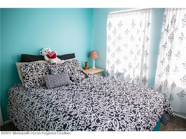 210 Osprey Court Tuckerton, NJ 08087 - Photo 13 of 24 a bed sitting in a bedroom next to a window