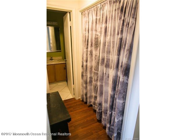 210 Osprey Court Tuckerton, NJ 08087 - Photo 14 of 24 a view of a bathroom with a shower curtain