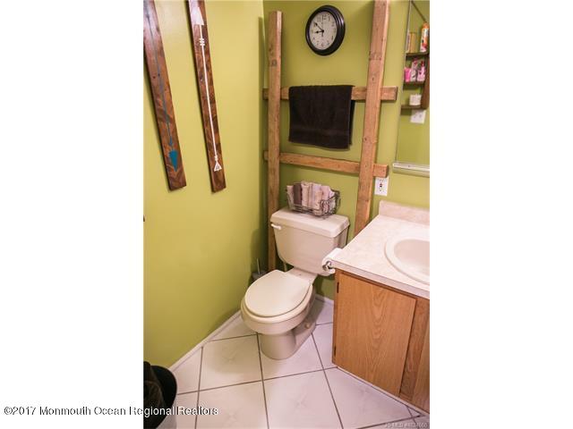 210 Osprey Court Tuckerton, NJ 08087 - Photo 15 of 24 a bathroom with a toilet and a sink
