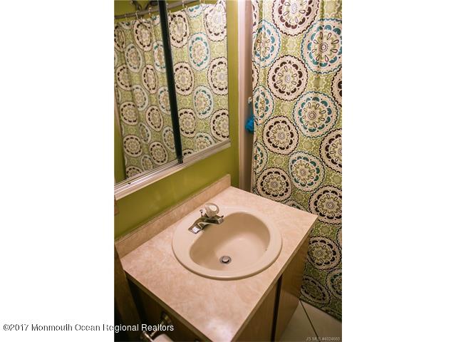 210 Osprey Court Tuckerton, NJ 08087 - Photo 16 of 24 a bathroom with a sink and a mirror