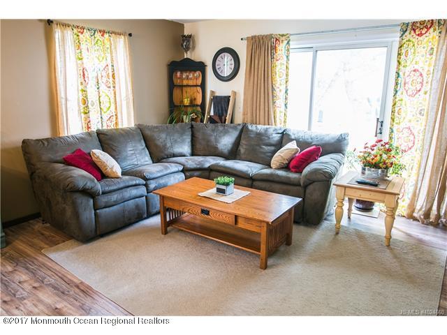 210 Osprey Court Tuckerton, NJ 08087 - Photo 3 of 24 a living room with furniture and a large window