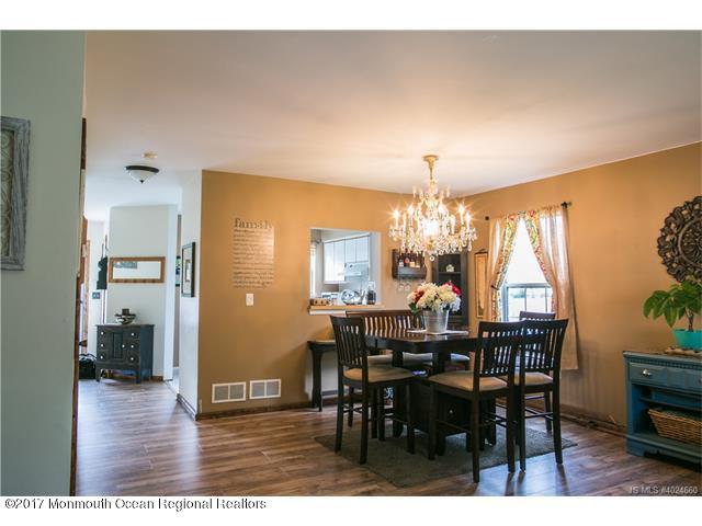 210 Osprey Court Tuckerton, NJ 08087 - Photo 6 of 24 a view of a dining room with furniture and chandelier