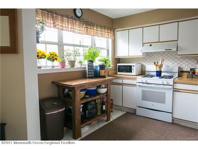 210 Osprey Court Tuckerton, NJ 08087 - Photo 8 of 24 a kitchen with a stove cabinets and a window