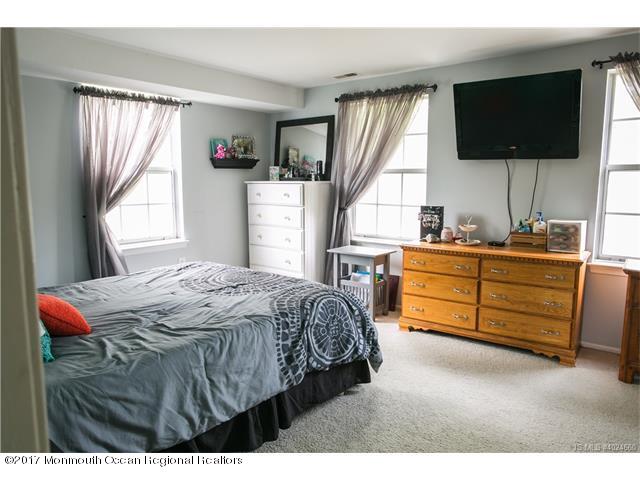 210 Osprey Court Tuckerton, NJ 08087 - Photo 10 of 24 a bedroom with a bed and a flat tv screen on dresser