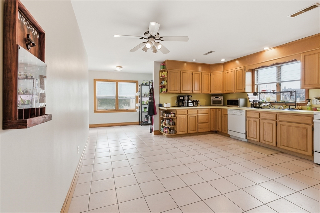4-6 Jensen Road, Unit 6 Watertown, MA 02472 - Photo 1 of 23 a kitchen with stainless steel appliances a stove sink and cabinets