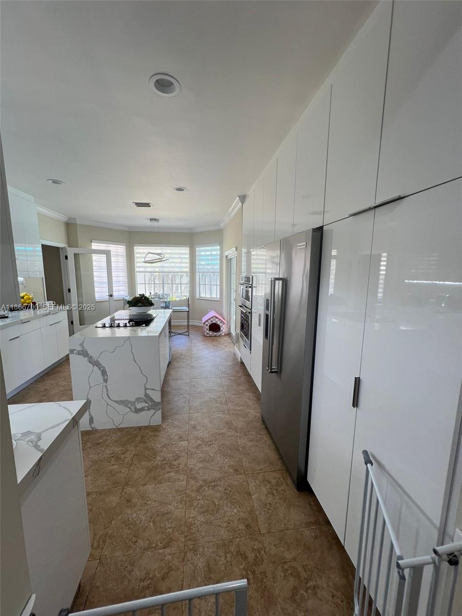 12365 Northwest 6th Street Miami, FL 33182 - Photo 15 of 36 a view of a refrigerator in kitchen and living room