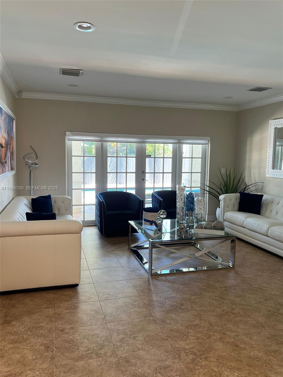 12365 Northwest 6th Street Miami, FL 33182 - Photo 8 of 36 a living room with furniture and a large window