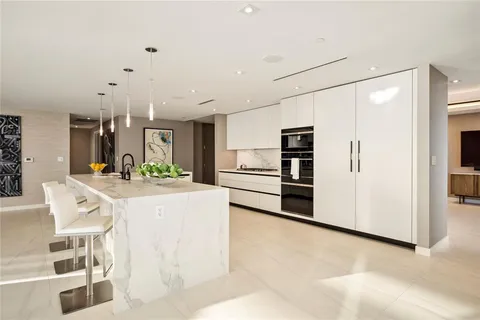 a living room with furniture ceiling fan and a rug