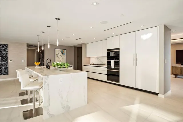 a bed room with large bed and a large window