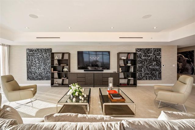 a spacious bedroom with a bed and a window