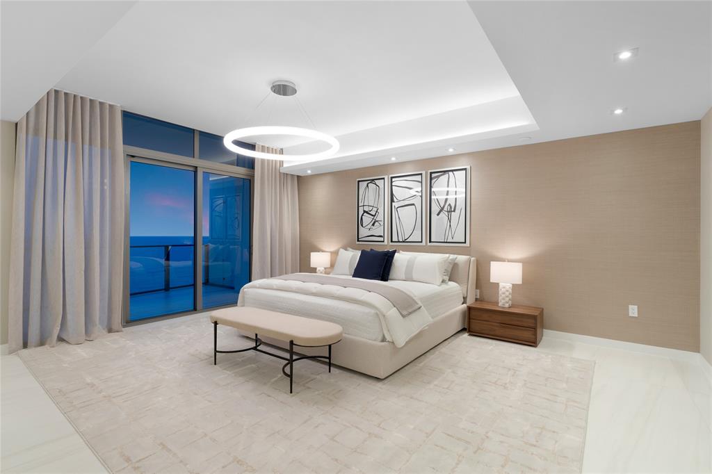 1116 North Ocean Boulevard, Unit UPH03 Pompano Beach, FL 33062 - Photo 26 of 84 a spacious bedroom with a bed and a window