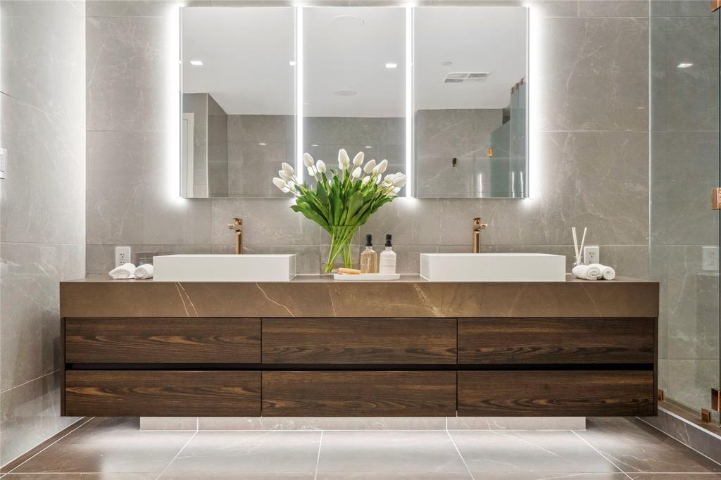 1116 North Ocean Boulevard, Unit UPH03 Pompano Beach, FL 33062 - Photo 30 of 84 a bathroom with a sink and a mirror