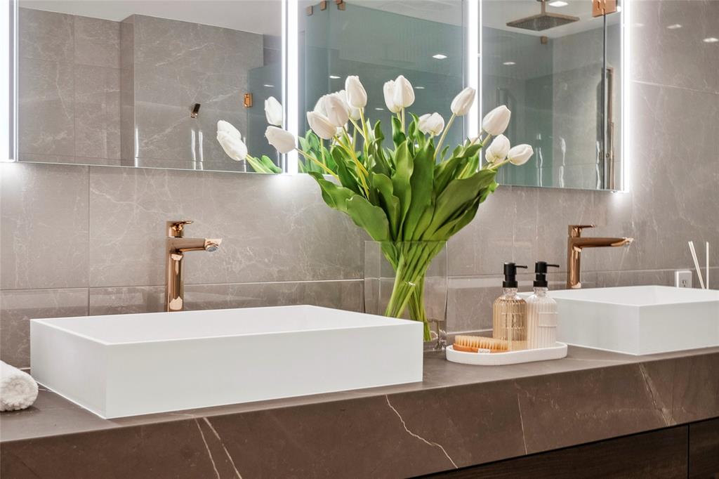 1116 North Ocean Boulevard, Unit UPH03 Pompano Beach, FL 33062 - Photo 31 of 84 a bathroom with a sink a faucet and a potted plant