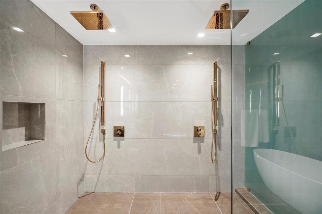 1116 North Ocean Boulevard, Unit UPH03 Pompano Beach, FL 33062 - Photo 32 of 84 a bathroom with a shower and a glass door