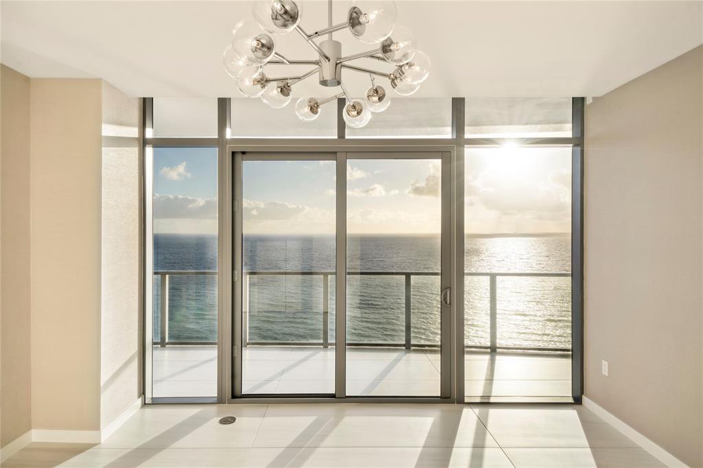 1116 North Ocean Boulevard, Unit UPH03 Pompano Beach, FL 33062 - Photo 45 of 84 a view of a glass door with a glass door