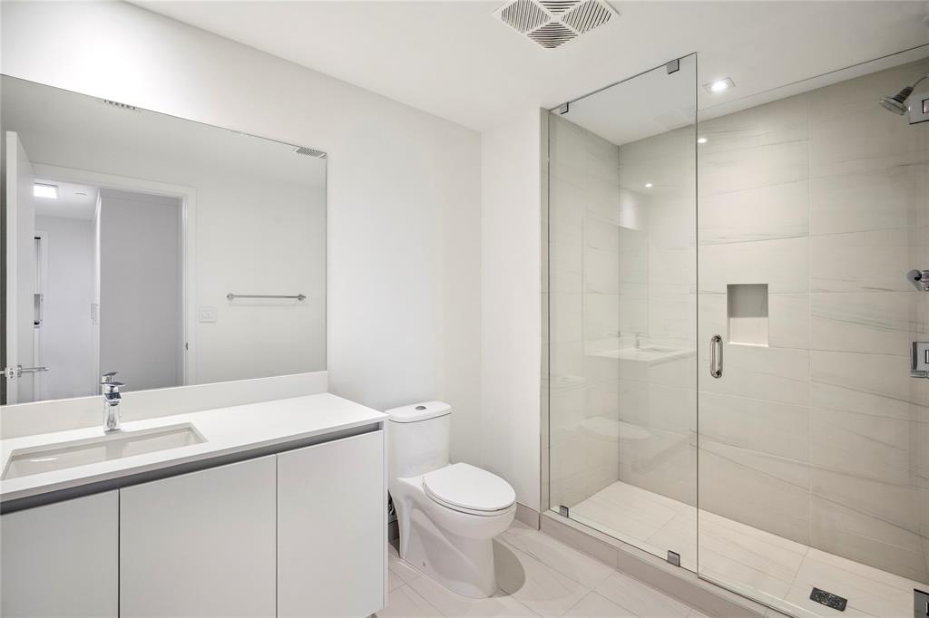 1116 North Ocean Boulevard, Unit UPH03 Pompano Beach, FL 33062 - Photo 46 of 84 a bathroom with a sink toilet and shower