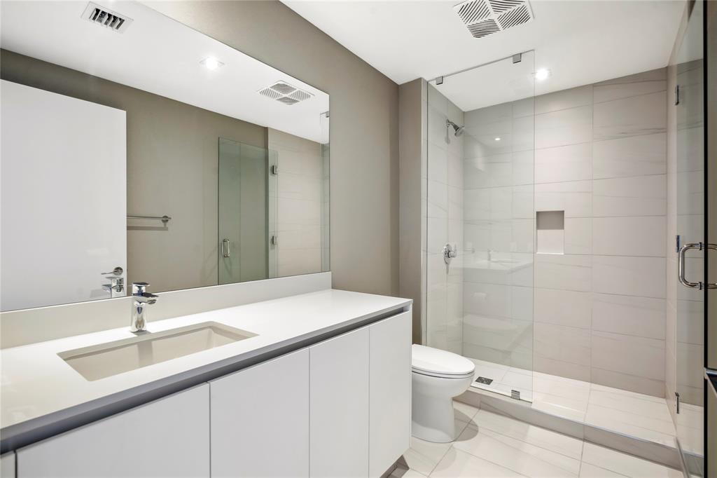 1116 North Ocean Boulevard, Unit UPH03 Pompano Beach, FL 33062 - Photo 56 of 84 a bathroom with a sink a toilet and shower