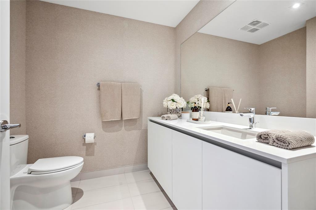 1116 North Ocean Boulevard, Unit UPH03 Pompano Beach, FL 33062 - Photo 58 of 84 a bathroom with a sink toilet and vanity