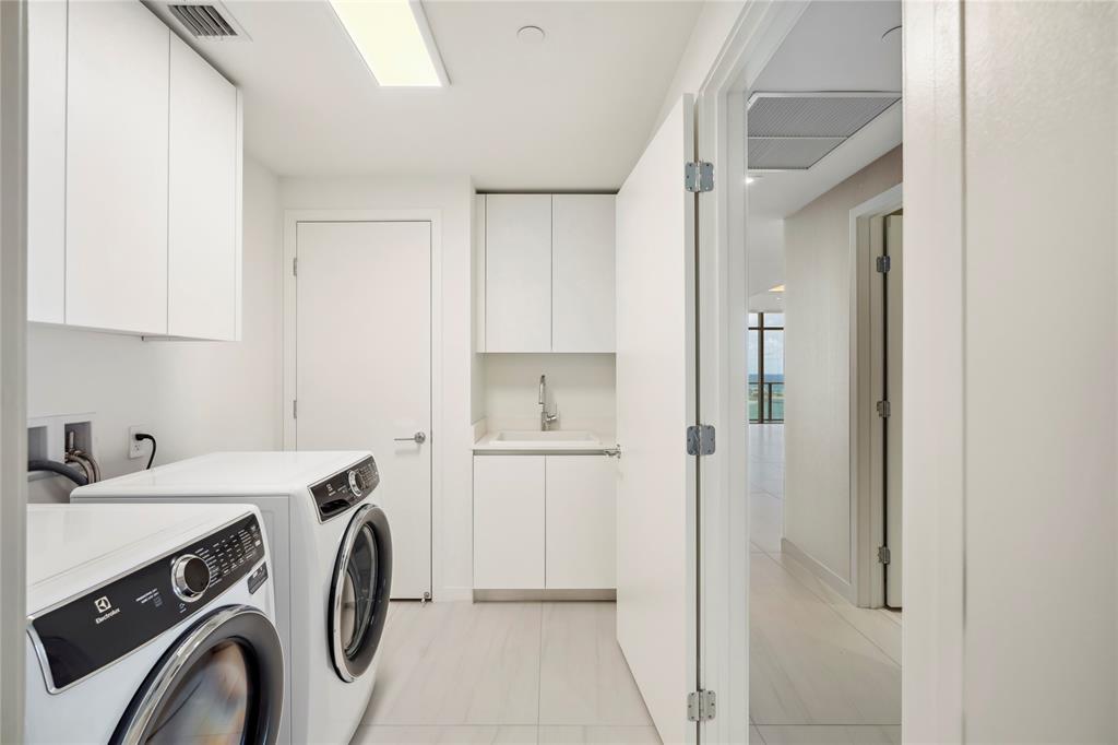 1116 North Ocean Boulevard, Unit UPH03 Pompano Beach, FL 33062 - Photo 60 of 84 a utility room with dryer and washer