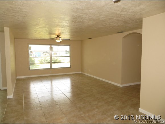 208 Virginia Street Edgewater, FL 32132 - Photo 12 of 15 a view of an empty room and window