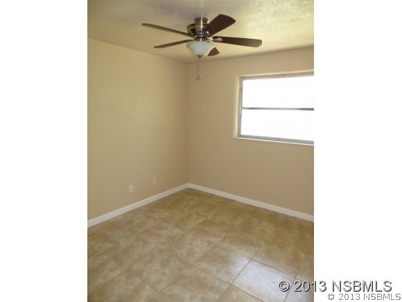 208 Virginia Street Edgewater, FL 32132 - Photo 14 of 15 a view of an empty room with a window