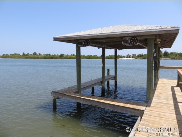 208 Virginia Street Edgewater, FL 32132 - Photo 15 of 15 a roof deck with table and chairs