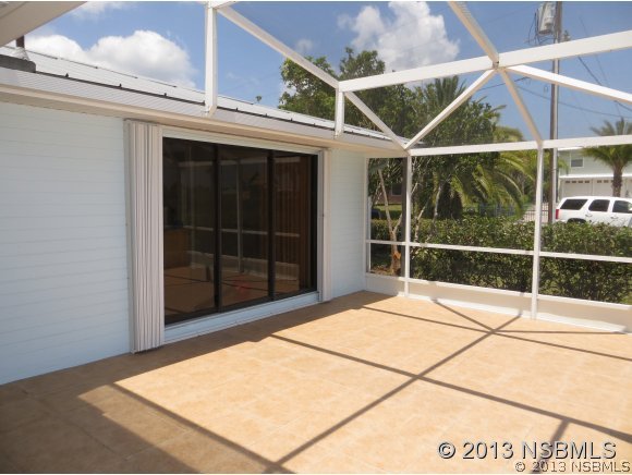 208 Virginia Street Edgewater, FL 32132 - Photo 10 of 15 a view of an empty room with a window