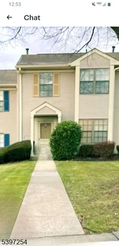 a front view of a house with yard