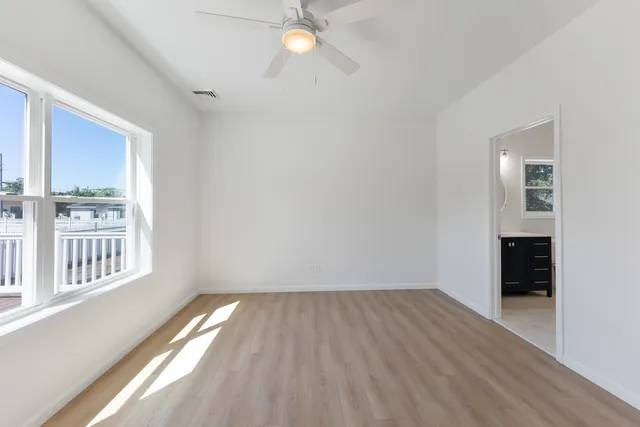 a view of a balcony with wooden floor
