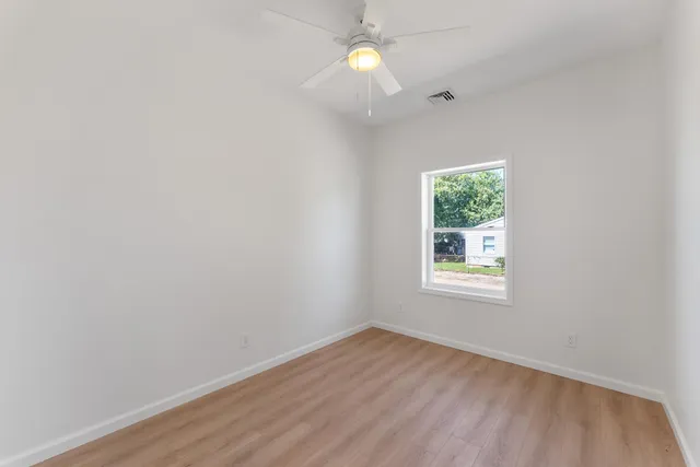 an aerial view of residential houses with outdoor space and swimming pool