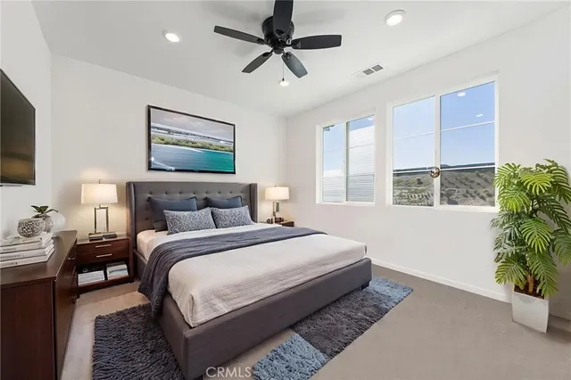 a bedroom with bed and a window