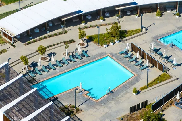 an aerial view of a house with a swimming pool