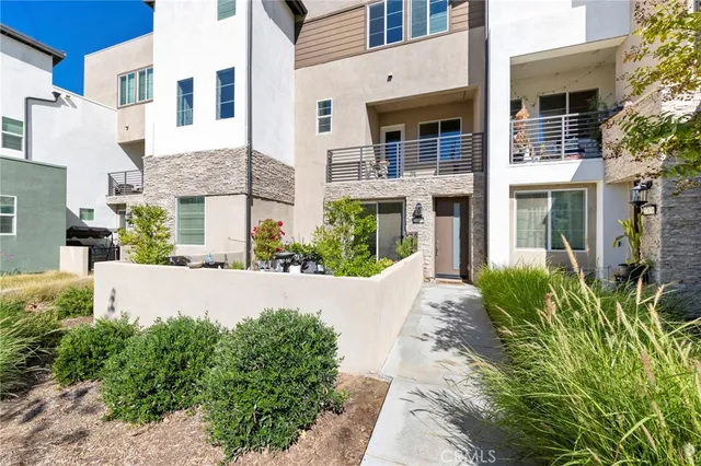 a view of a building with potted plants