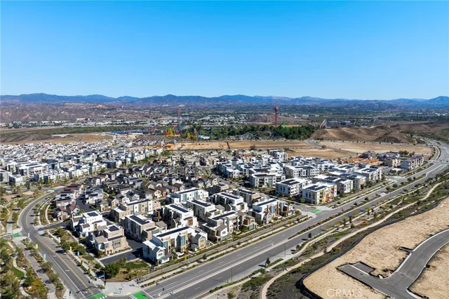 an aerial view of a house with a swimming pool