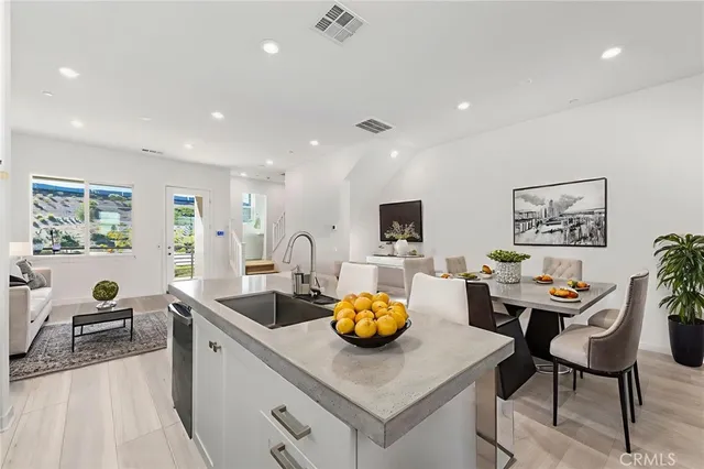 a kitchen with a dining table and chairs