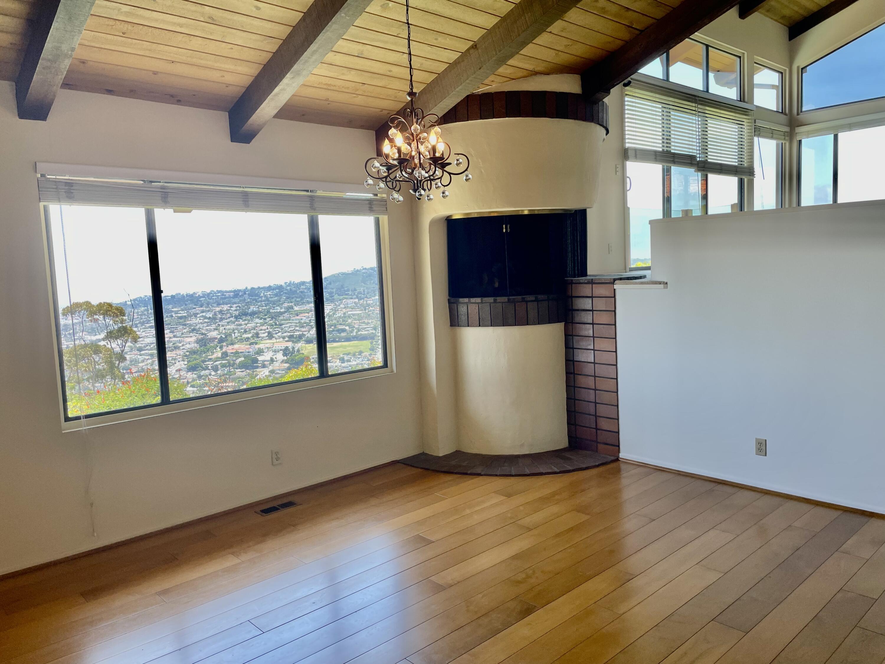 260 Loma Media Road Santa Barbara, CA 93103 - Photo 5 of 23 a view of a room with wooden floor and chandelier