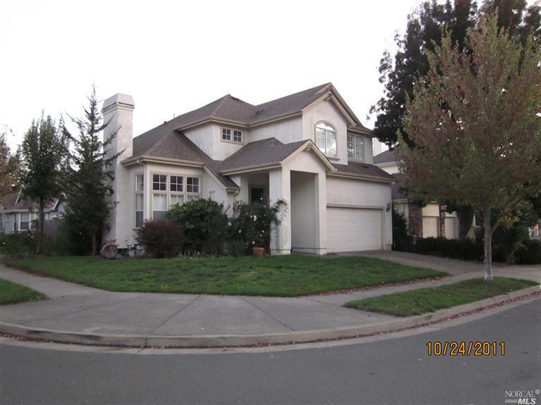 4719 Prospect Avenue Santa Rosa, CA 95409 - Photo 1 of 1 a front view of a house with a yard and garage