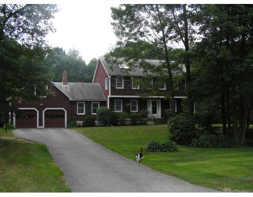 16 Michigan Road Tyngsborough, MA 01879 - Photo 1 of 8 a front view of a house with a garden