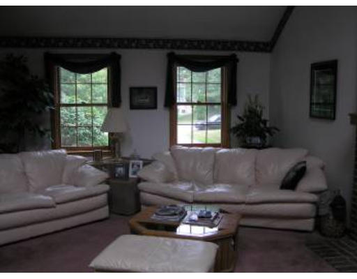 16 Michigan Road Tyngsborough, MA 01879 - Photo 4 of 8 a living room with furniture and a large window